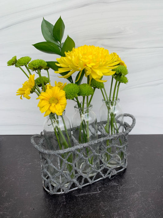 Three Glass Bottles In A Jute Basket